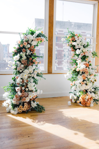 Wedding arch rental Chicago — floral ceremony arch backdrop for wedding reception