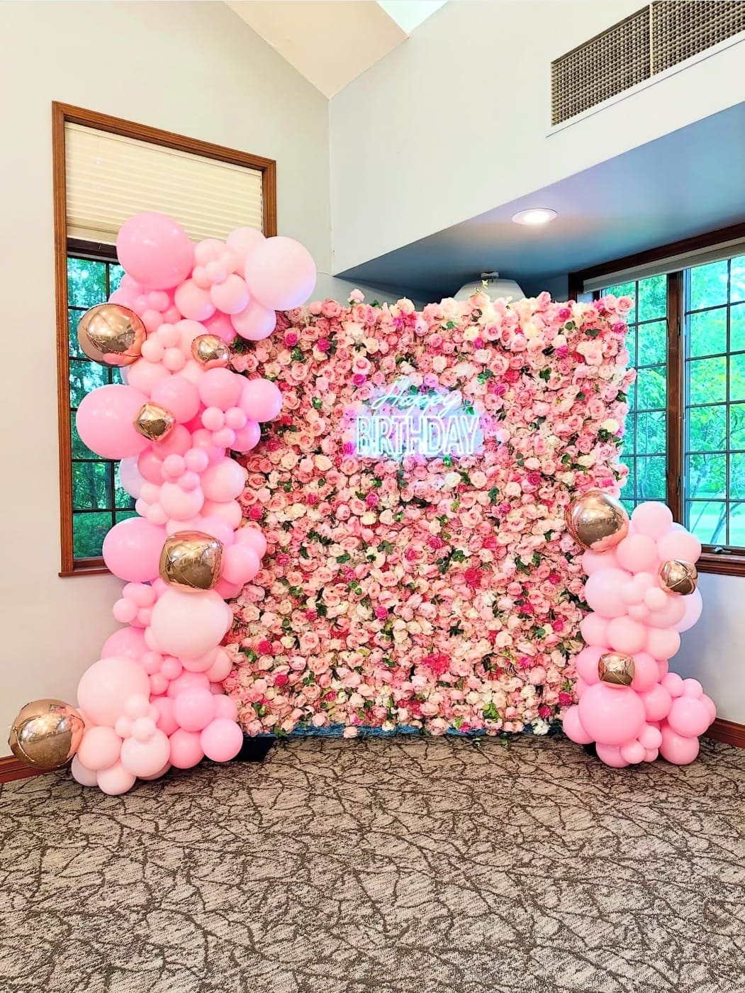 Birthday flower wall rental Chicago — pink rose flower wall with Happy Birthday neon sign and balloon garland