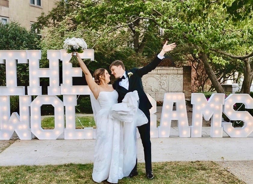 Wedding marquee letter rental Chicago — outdoor custom last name letters with wedding couple celebration